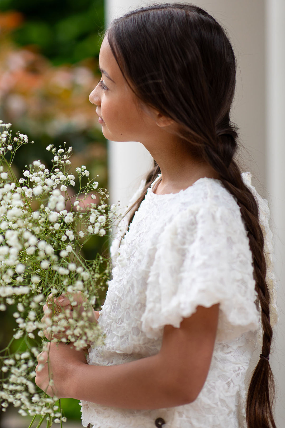 Top woven with balloon sleeves and bow on the back Off white